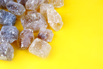 on a yellow background of cane sugar in the form of pieces