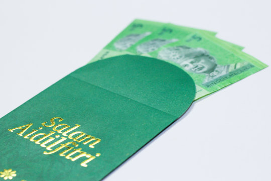 'Duit Raya' is money given from adult to children during Eid al-Fitr celebration in Malaysia. This is a Malay tradition and regarded as alms to the children.