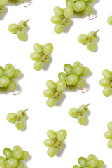 Top view flat lay green grapes pattern isolated on white background. Vegetarian food concept, wine. Detox