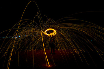 burning and spinning steel wool in night
