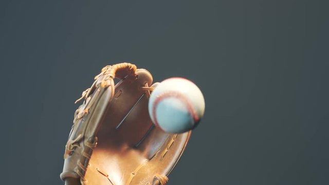 Dynamic flying baseball catch in the spotlight. Epic foggy slow motion shot 4KHD