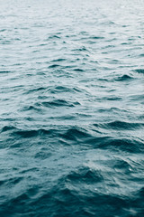 Naklejka premium ripples on blue sea water , natural sea background