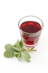 Red wine in a glass with sage