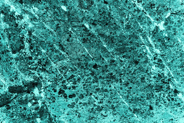 Vintage azure background. Rough painted wall of turquoise color. Imperfect plane of cyan colored. Uneven old decorative toned backdrop of aqzure tint. Texture of teal hue. Ornamental stony surface.