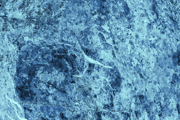 Vintage blue background. Rough painted wall of sapphire color. Imperfect plane of blue colored. Uneven old decorative toned backdrop of cyan tint. Texture of sapphirine hue. Ornamental stony surface.