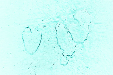 Vintage azure background. Rough painted wall of turquoise color. Imperfect plane of cyan colored. Uneven old decorative toned backdrop of aqzure tint. Texture of teal hue. Ornamental stony surface.