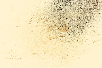 Fototapeta na wymiar Vintage yellow background. Rough painted wall of aspen gold color. Imperfect plane of golden colored. Uneven old decorative toned backdrop of yellow tint. Texture of gold hue. Ornamental stony surface