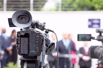 Filming news or press conference with a video camera