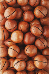 Organic macadamia nut fresh natural fruit shelled one nut in full frame close-up view. Low contrast