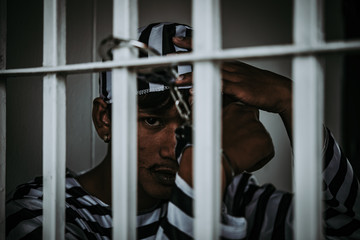 Hands of men desperate to catch the iron prison,prisoner concept,thailand people,Hope to be free.