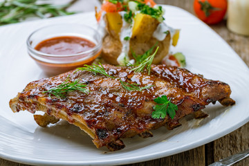 Barbecue pork ribs on wooden background