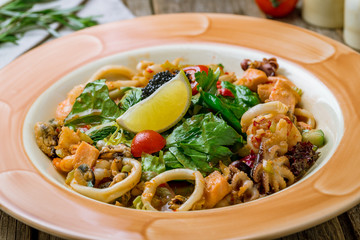 Salad with seafood on plate