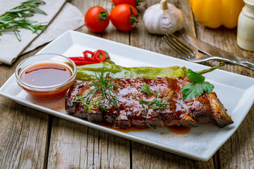 Barbecue pork ribs on wooden background
