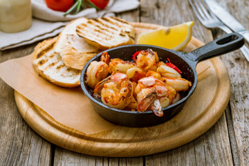 Tiger prawns fried in a cast iron pan