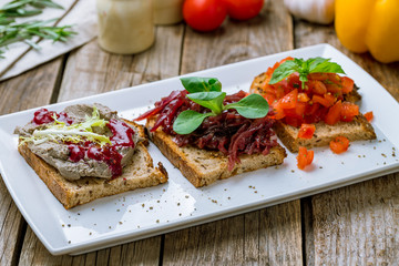 assorted bruschett on a white plate