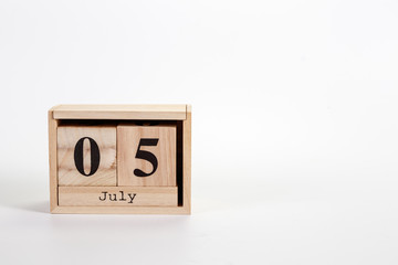 Wooden calendar July 05 on a white background