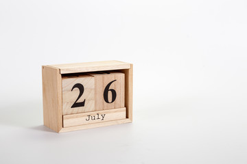 Wooden calendar July 26 on a white background