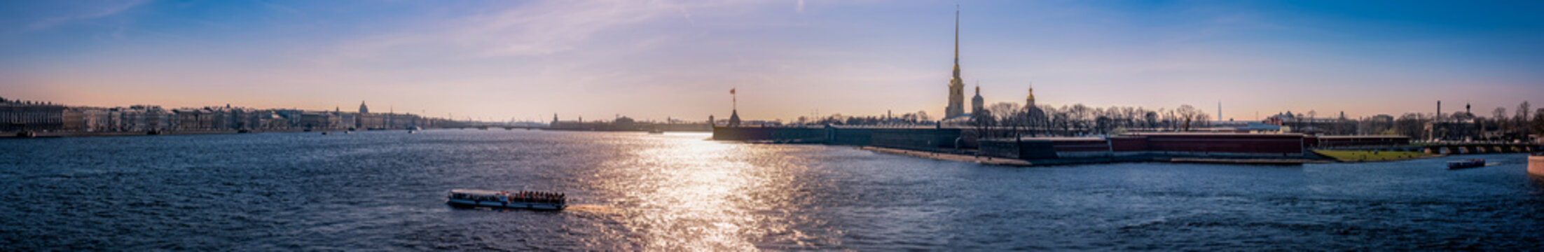 Backlight panorama of the Neva River at the downtown of Saint Petersburg, Russia with the Peter and Paul Fortress on its right bank
