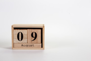 Wooden calendar August 09 on a white background