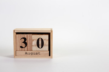 Wooden calendar August 30 on a white background