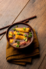 Baby Corn Manchurian with gravy - popular Indo-chinese recipe. selective focus