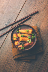 Baby Corn Manchurian with gravy - popular Indo-chinese recipe. selective focus