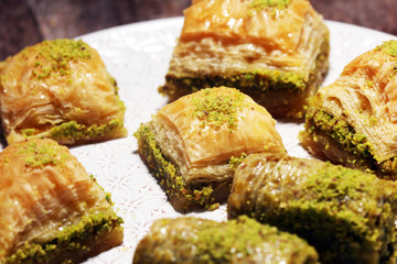 Middle eastern or arabic dishes. Turkish Dessert Baklava with pistachio on dishes