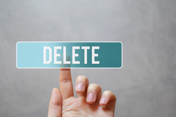 Delete - finger pressing green translucent start button on virtual touchscreen interface on grey...