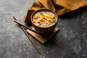 Baby Corn Manchurian with gravy - popular Indo-chinese recipe. selective focus
