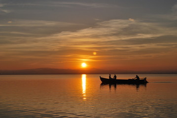 Naklejka na ściany i meble Sunset in the mediterranean lake