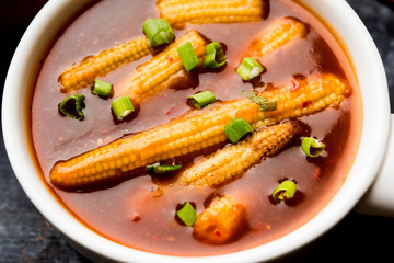 Baby Corn Manchurian with gravy - popular Indo-chinese recipe. selective focus