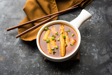 Baby Corn Manchurian with gravy - popular Indo-chinese recipe. selective focus