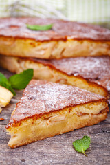 Pie with apple and pear on wooden rustic table. Close up