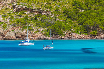Cala Algaiarens Сove with Yachts Floating on Water