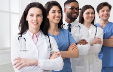 Successful Team Of Medical Interns Standing In Hospital