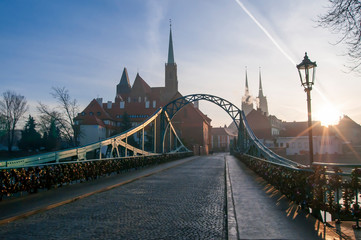 Tumski Bridge and Cathedral of St. John the Baptist twin towers on Ostrow Tumski. Wrocław, Poland 2018 - obrazy, fototapety, plakaty