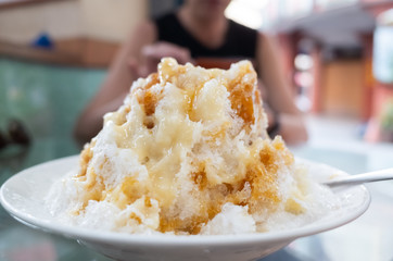 eating shaved ice with colorful dessert