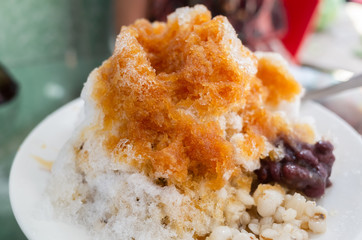 eating shaved ice with colorful dessert