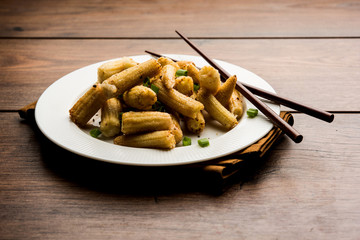 Baby Corn Manchurian dry - popular Indo-chinese starter recipe. selective focus