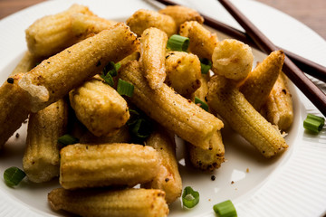 Baby Corn Manchurian dry - popular Indo-chinese starter recipe. selective focus