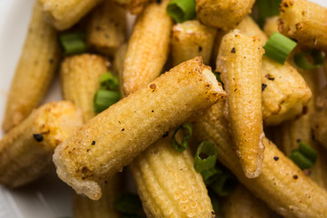 Baby Corn Manchurian dry - popular Indo-chinese starter recipe. selective focus