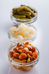 pickled vegetables on a white acrylic background