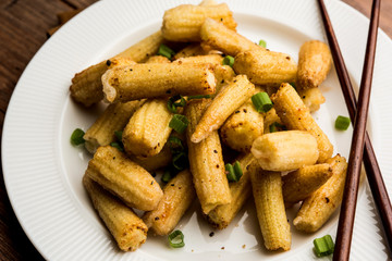 Baby Corn Manchurian dry - popular Indo-chinese starter recipe. selective focus