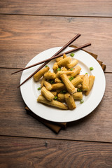Baby Corn Manchurian dry - popular Indo-chinese starter recipe. selective focus