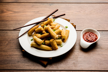 Baby Corn Manchurian dry - popular Indo-chinese starter recipe. selective focus