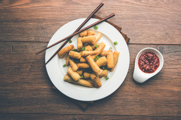 Baby Corn Manchurian dry - popular Indo-chinese starter recipe. selective focus