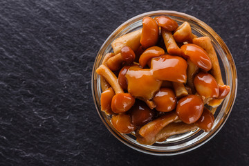 pickled vegetables on a dark stone background