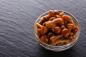 pickled vegetables on a dark stone background
