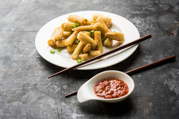 Baby Corn Manchurian dry - popular Indo-chinese starter recipe. selective focus