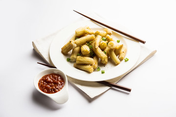 Baby Corn Manchurian dry - popular Indo-chinese starter recipe. selective focus